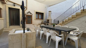 Village house with patio and barbecue